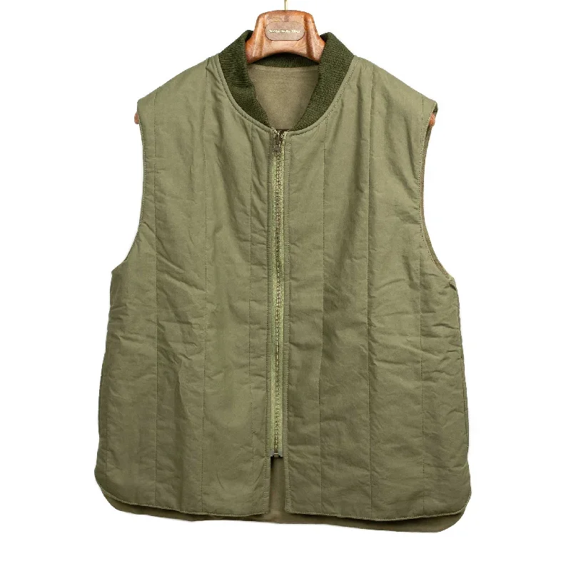 Reversible wadded gilet in fern green moleskin and dry wax cotton